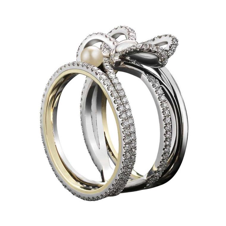 Diamond Bow and Pearl ring by Alexandra Mor jewelry with the designer's signature 1mm knife-edged wire, set in platinum around inner bands of yellow gold.